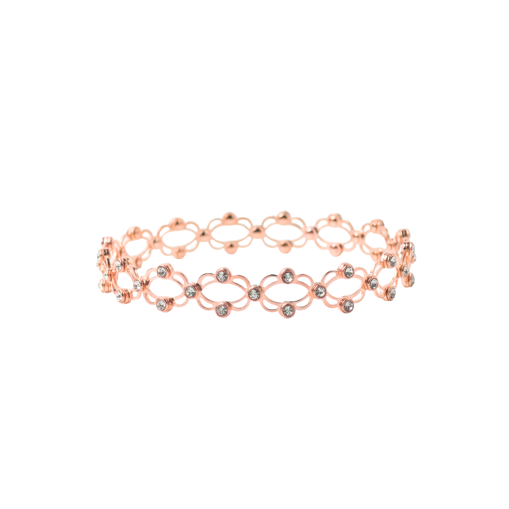 Rose gold bracelet with small stones on a white background