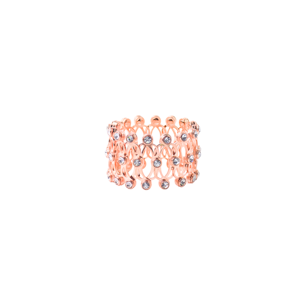 Rose gold ring with gemstones on a white background