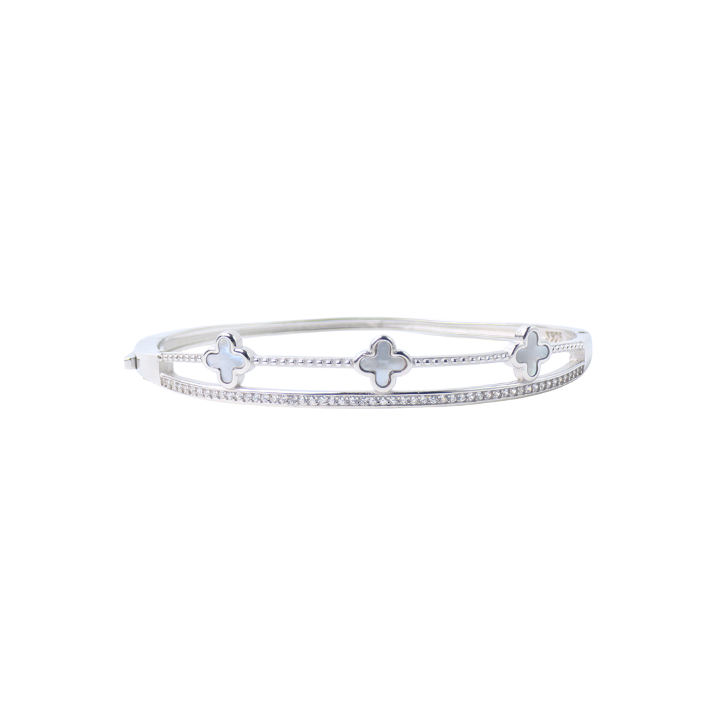 Silver bracelet with clover-shaped charms on a white background